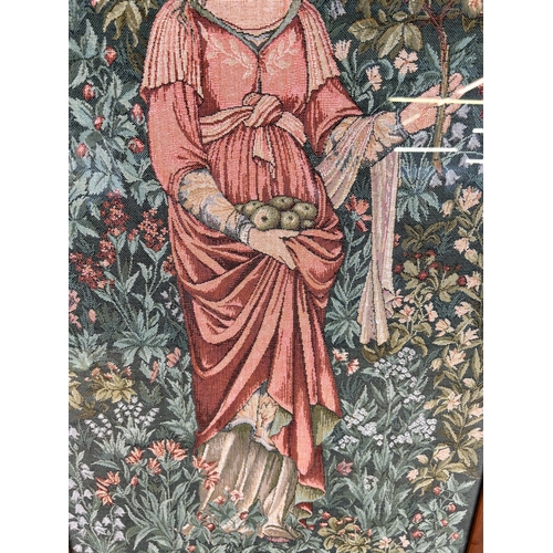 192 - A framed Arts and Crafts style tapestry of a lady holding apples - approx. 76cm high x 48cm wide