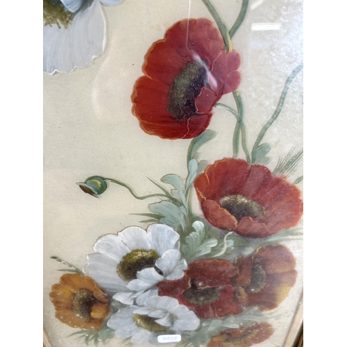 212 - Two framed floral still life pictures, one early 20th century oil on glass and one print