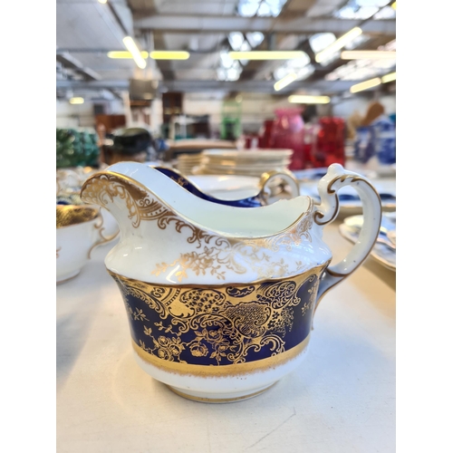 327 - Seventy six pieces of Aynsley cobalt blue and gold china