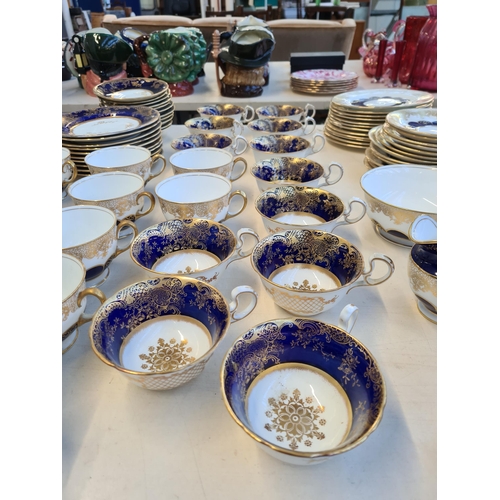 327 - Seventy six pieces of Aynsley cobalt blue and gold china