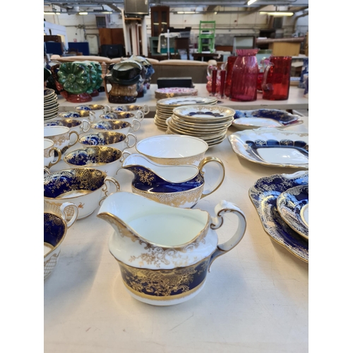 327 - Seventy six pieces of Aynsley cobalt blue and gold china