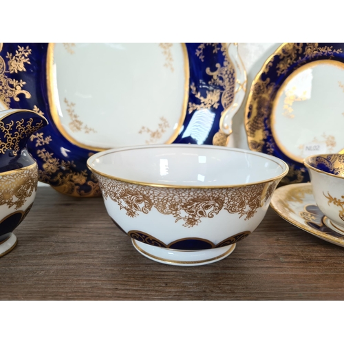 327 - Seventy six pieces of Aynsley cobalt blue and gold china