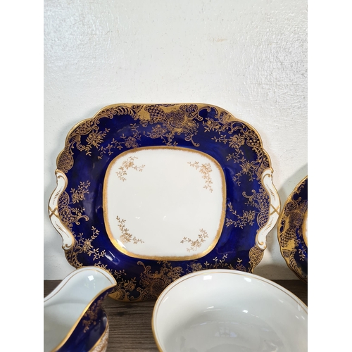 327 - Seventy six pieces of Aynsley cobalt blue and gold china