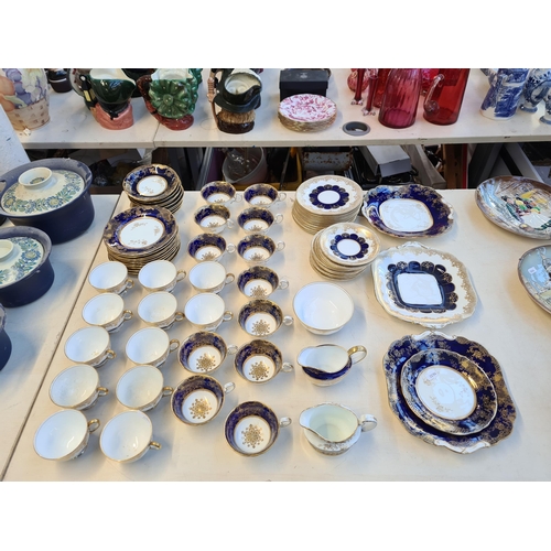 327 - Seventy six pieces of Aynsley cobalt blue and gold china