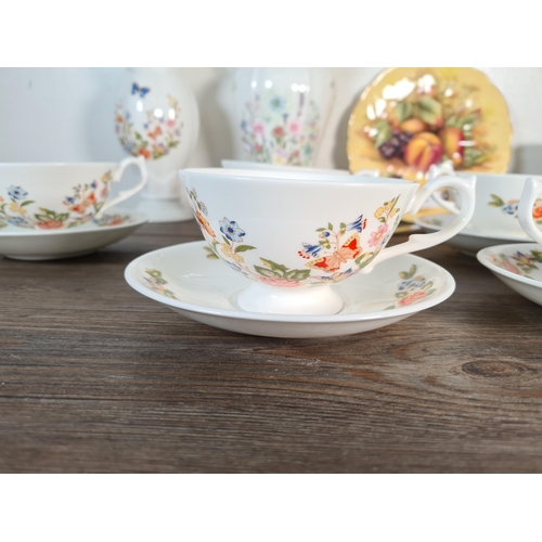 330 - Seventeen pieces of Aynsley fine bone china, six Cottage Garden cups and saucers, one Orchard Gold c... 