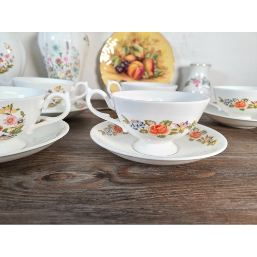 330 - Seventeen pieces of Aynsley fine bone china, six Cottage Garden cups and saucers, one Orchard Gold c... 