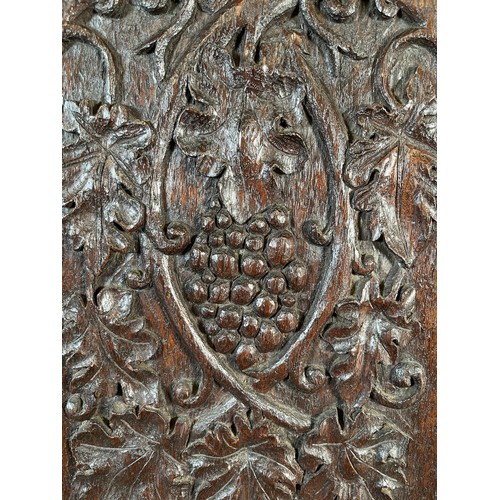 6 - An early 20th century carved oak single door cabinet with foliate and berry design - approx. 45cm hi... 