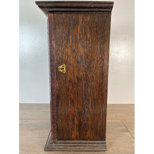 6 - An early 20th century carved oak single door cabinet with foliate and berry design - approx. 45cm hi... 