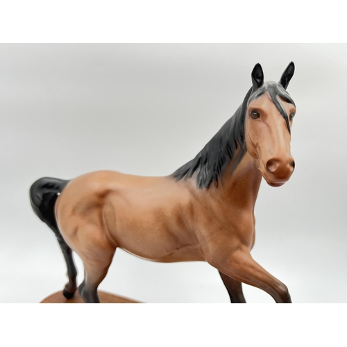 227 - A Beswick Spirit of The Wind horse figurine on mahogany plinth - approx. 24cm high x 24cm wide