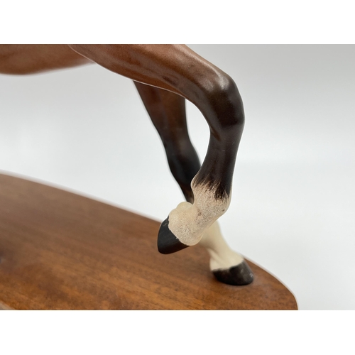 227 - A Beswick Spirit of The Wind horse figurine on mahogany plinth - approx. 24cm high x 24cm wide