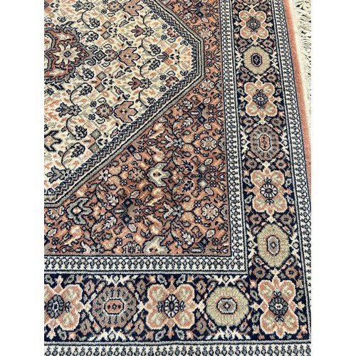 114 - A Persian style rug - approx. 200cm x 140cm