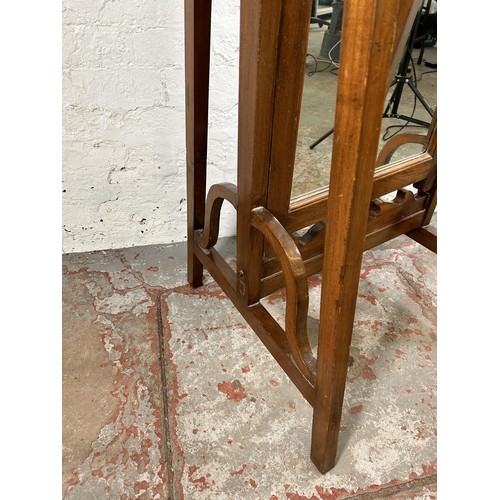 134 - An Arts and Crafts style mahogany cheval mirror - approx. 162cm high x 59cm wide x 60cm deep