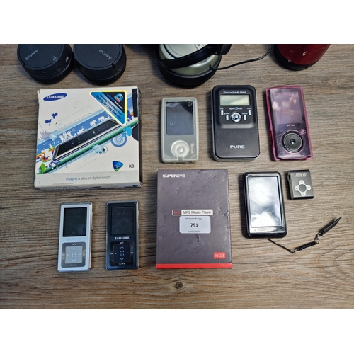 751 - A collection of headphones and portable media players to include boxed Samsung K3, Pure PocketDAB 15... 