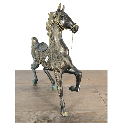 351 - A novelty brass, gilded and etched trotting stallion - approx. 39cm high x 38cm long