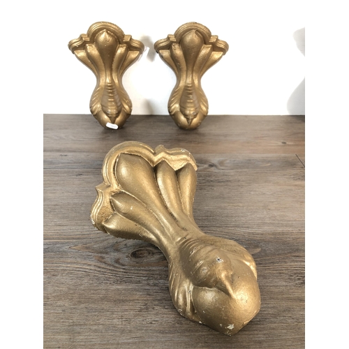 352 - A set of four Victorian cast iron and gilded ball on claw bath supports, stamped no. 73 - approx. 26... 