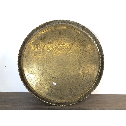 360 - Two late 19th/early 20th century brass wall chargers, one Kinco octagonal and one Cairoware circular... 