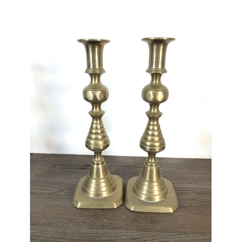 376 - Nine 19th century style brass candlesticks