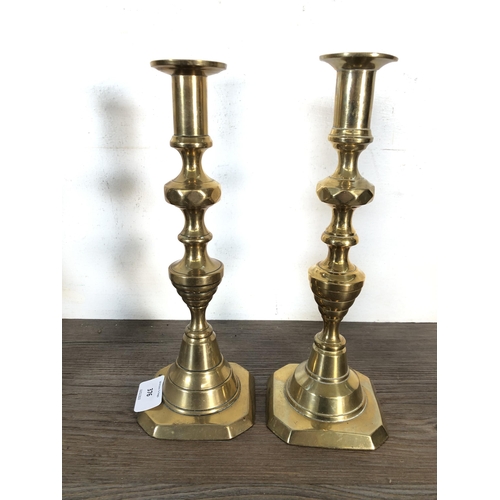 376 - Nine 19th century style brass candlesticks