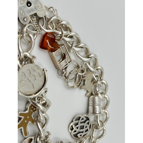 1156 - A sterling silver charm bracelet - approx. gross weight 38.5 grams