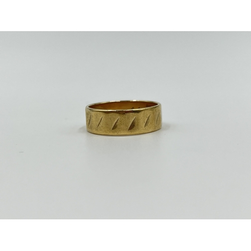 1157 - A hallmarked London 9ct gold textured band ring, size N - approx. gross weight 3.3 grams