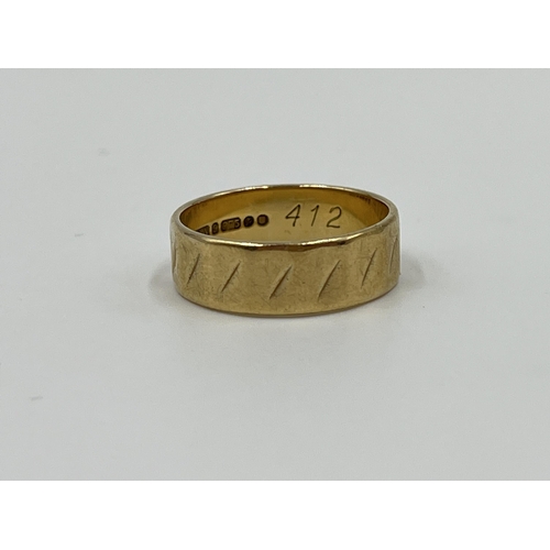 1157 - A hallmarked London 9ct gold textured band ring, size N - approx. gross weight 3.3 grams