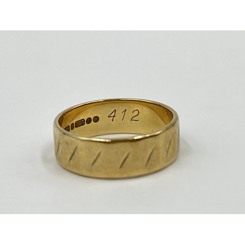 1157 - A hallmarked London 9ct gold textured band ring, size N - approx. gross weight 3.3 grams