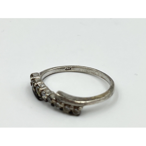 1159 - Five pieces of jewellery to include .925 silver half crown hammered ring, .925 silver CZ ring, rolle... 