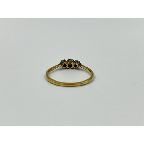 1161 - An 18ct gold and platinum diamond trilogy ring, size P½ - approx. gross weight 1.85 grams