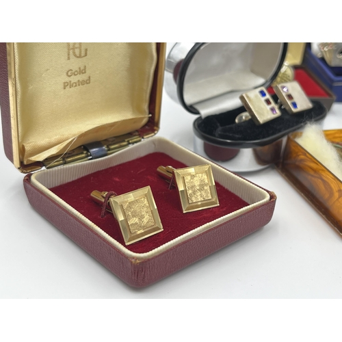 1163 - A collection of boxed cufflinks