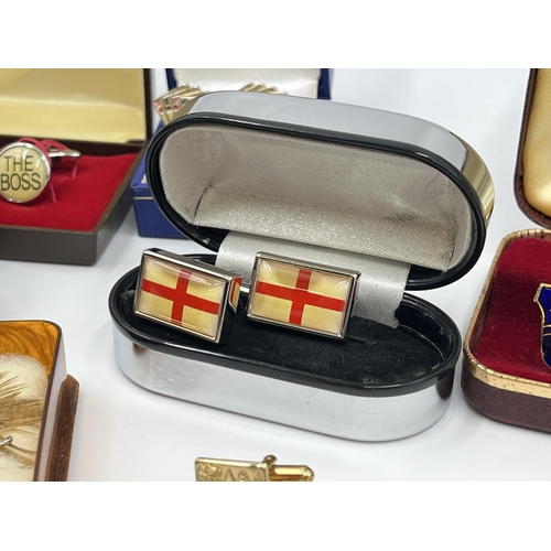 1163 - A collection of boxed cufflinks