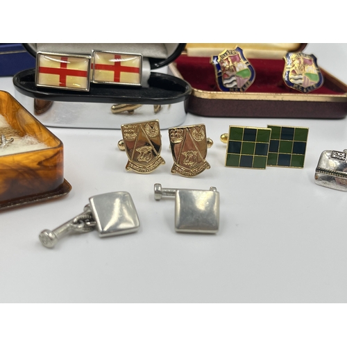 1163 - A collection of boxed cufflinks