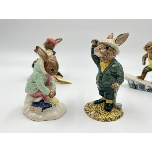 255 - Six Royal Doulton Bunnykins figurines to include Bogey Bunnykins DB32, Aussie Surfer Bunnykins DB133... 