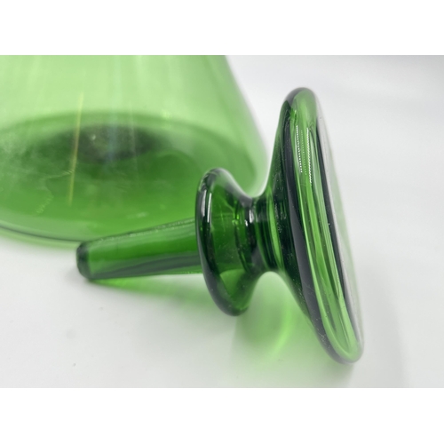 259 - A green glass decanter - approx. 32cm high