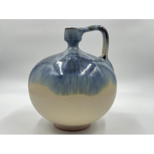 273 - A mid 20th century drip glazed studio pottery jug stamped MG to base - approx. 21cm high