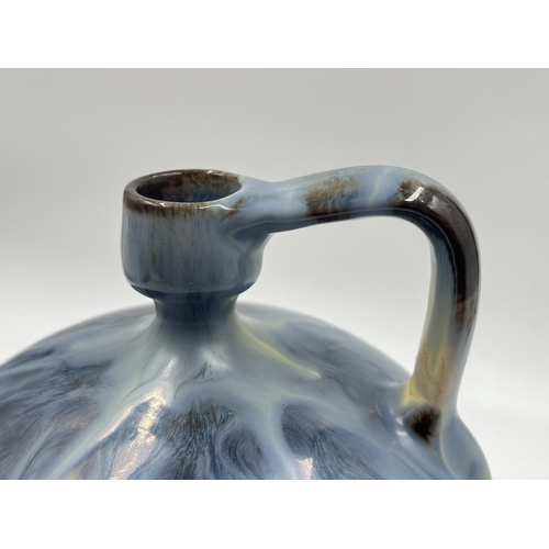 273 - A mid 20th century drip glazed studio pottery jug stamped MG to base - approx. 21cm high