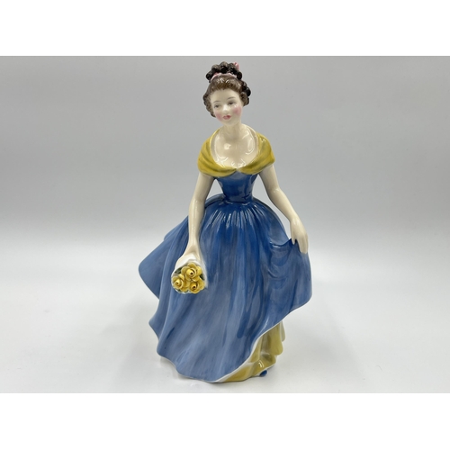 275 - Two ceramic figurines, one Royal Doulton Melanie HN 2271 and one Nao by Lladro First Love - model no... 