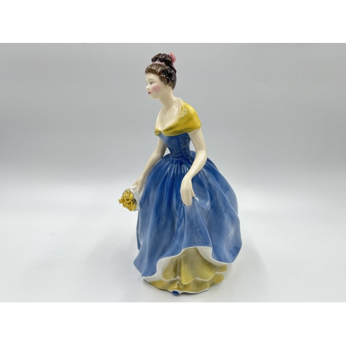 275 - Two ceramic figurines, one Royal Doulton Melanie HN 2271 and one Nao by Lladro First Love - model no... 