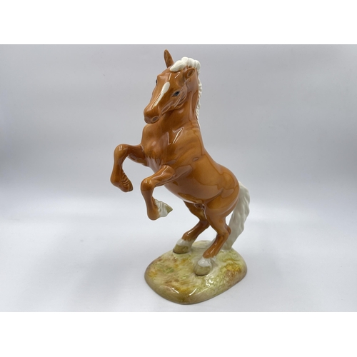 284E - A Beswick Rearing Palomino Welsh cob horse figurine - model no. 1014