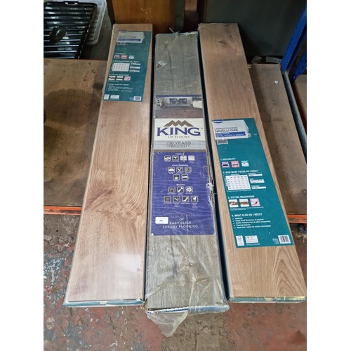 835 - Three packs of laminate flooring, two Wickes 12mm thick Navelli oak and one King 12mm