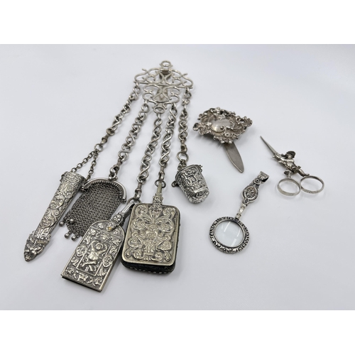 1230 - A Victorian EPNS chatelaine with eight accessories to include .800 silver scissors etc.