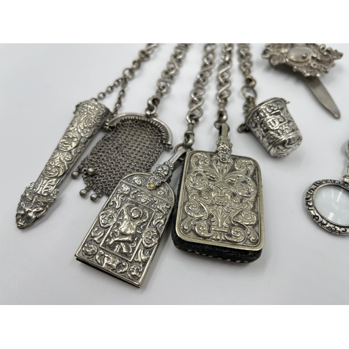 1230 - A Victorian EPNS chatelaine with eight accessories to include .800 silver scissors etc.