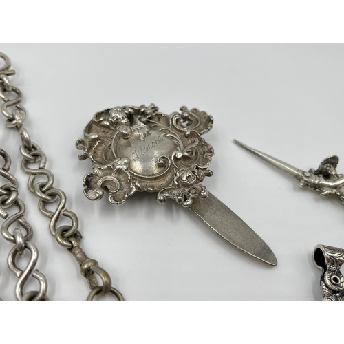 1230 - A Victorian EPNS chatelaine with eight accessories to include .800 silver scissors etc.