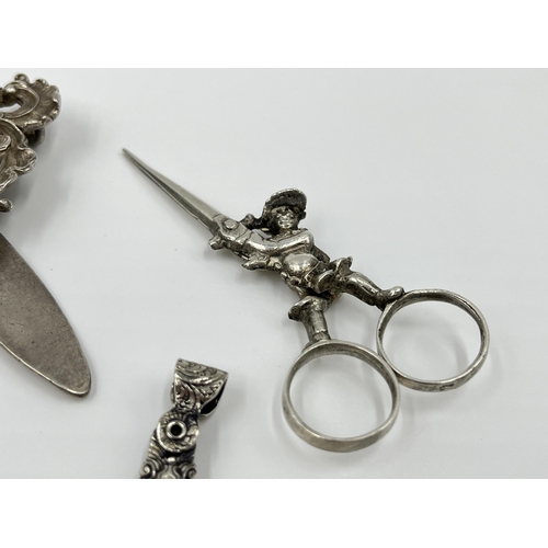 1230 - A Victorian EPNS chatelaine with eight accessories to include .800 silver scissors etc.