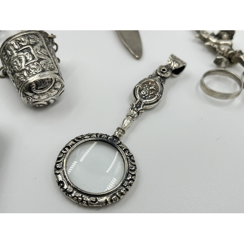 1230 - A Victorian EPNS chatelaine with eight accessories to include .800 silver scissors etc.