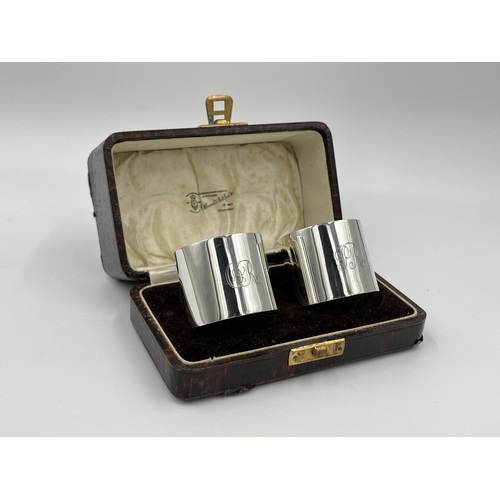 1235 - A cased pair of Ollivant & Botsford hallmarked Birmingham silver napkin rings, dated 1934 - approx. ... 