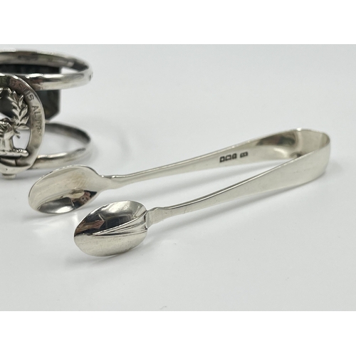 1237 - Three pieces of hallmarked sterling silver, one Edinburgh silver Ross Clan napkin ring dated 1896, o... 