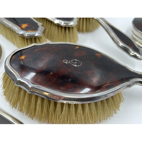 1239 - An Adie Brothers Ltd hallmarked Birmingham silver and tortoise shell five piece dressing table set, ... 