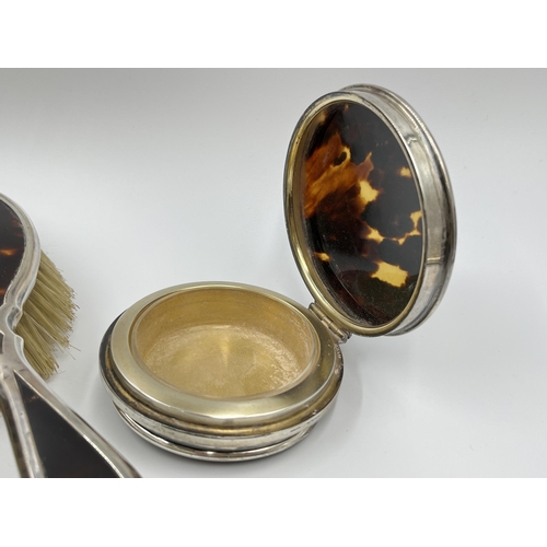 1239 - An Adie Brothers Ltd hallmarked Birmingham silver and tortoise shell five piece dressing table set, ... 