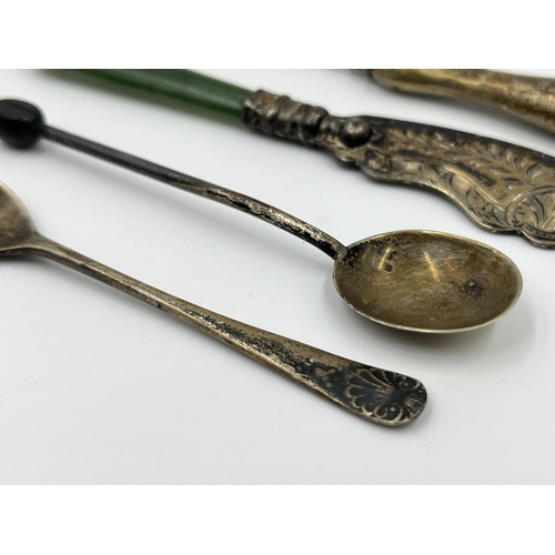 1240 - Four hallmarked sterling silver items to include silver handled tweezers etc.