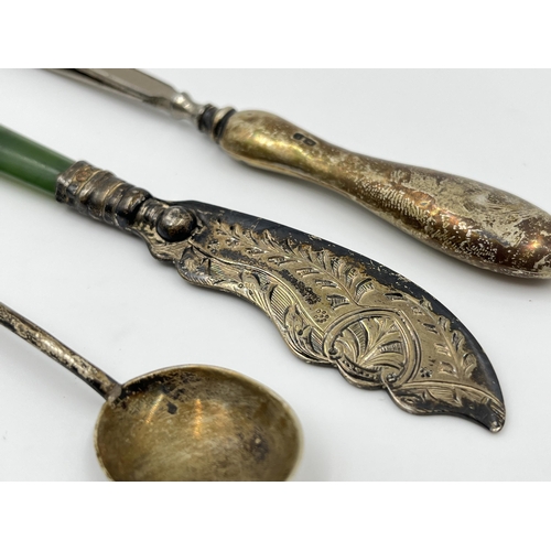 1240 - Four hallmarked sterling silver items to include silver handled tweezers etc.